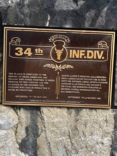 "This plaque is dedicated to the memory of those Americans and Italians who joined together to bring freedom to this country. Let the sacrifice of the soldiers and civilians who died in World War II never be forgotten. September 1943 to May 1945." Presented by the 34th Infantry Division Association May 1997.
