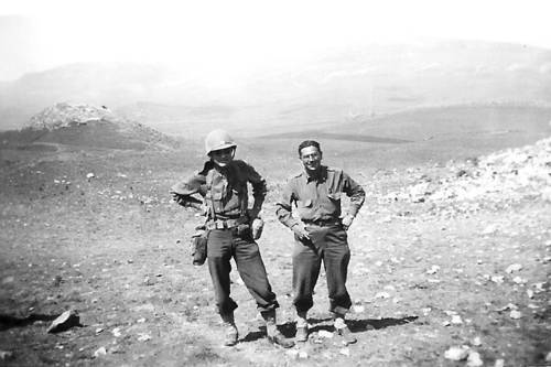 June, I943: North Africa: "The picture is one that Geo. Coulon (one of the boys I brought with me from the 133rd) took during the last big push around Sidi Nsir.  It was taken at the 2nd Bn. Aid Sta. which I had dropped in on about something.  At that time it was about 3 miles behind the lines, but they moved to the front the next day.  The officer is Capt. Moses Cohen, my 2nd Bn. Surgeon.