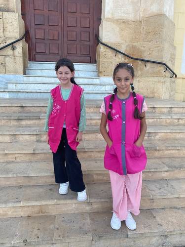 At the Basilica, we saw these two school girls on its steps. School children wear “aprons” as their uniform over their own clothes. Girls wear bright pink, and boys wear blue. (Naturally) Each student can personalize their tunic with special embroidery or action figures.