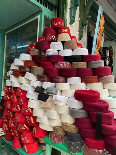The “Chachia” is a flexible hat worn by men that originated in Tunisia and Libya. It is typically made from wool that has been crushed with hot water and soap, then dyed, and shaped. I noticed that these hats are now made in a variety of colors - even pink, probably to appeal to tourists. 
