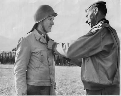14 March 1944:  Major Arthur L. Ludwick Jr, M.D. of Waterloo, IA, is decorated with the Silver Star by Lt. Gen. Mark W. Clark in a ceremony at Fifth Army Headquarters in Italy. A member of the 34th Infantry Division, Major Ludwick was honored for his "gallantry-in-action" at Mt. Pantano, Italy. Photo credit: NEA Service, Inc. 
