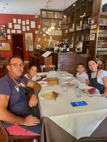 #25 Our delicious lunch in Eboli at il Panigaccio, while we waited for Luigi to pick us up. We ate at an odd hour (~1:30 pm), and the owner chef and his family were eating also, prior to the lunch and dinner rush. Dinner service in Italian restaurants never starts before ~7:45 pm. I'm pretty sure Gustavo and his family lived above the restaurant.