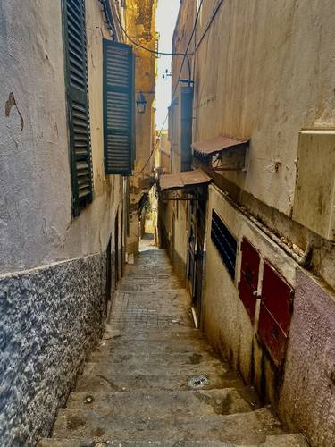 The narrow pathways of the Casbah punctuated by endless stairs. Thousands of people live and carry out their lives in the Casbah.