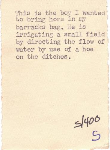 Lud's typed caption on back of photo of little Tunisian boy.