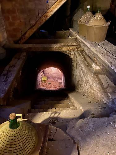  After entering the pigeon-infested space, Silvano gave us a tour. The stairs leading down to the wine cellar, was an air raid shelter as well as the American troops' headquarters during bombings.