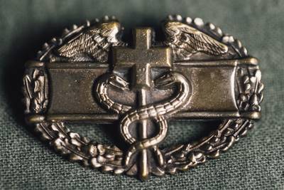 The Combat Medical Badge. My father applied for and was awarded the CMB for his service during intense battles in Tunisia, North Africa. The Combat Medical Badge is an award of the U.S. Army, which was first created in January 1945 (retroactive to 1941). Any member of the Army Medical Department, at the rank of Colonel or below, who is assigned or attached to a ground combat arms unit of brigade or smaller size which provides medical support during any period in which the unit was engaged in ground combat, is eligible for the CMB. According to the award criterion, the individual must be performing medical duties while simultaneously being engaged by the enemy. 
