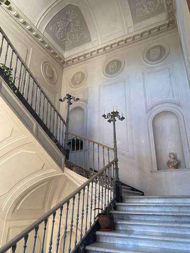 The former Palace, built on ancient Roman foundations, underwent a huge restoration in the second half of the 1800s.The courtyard opens to the enchanting panoramic garden and the marble staircase that leads to the main floor.