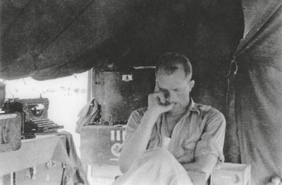 1943, North Africa: "Deep study . . . “  Note the Remington typewriter in this photo. As a Medical Officer on the front lines, Lud lugged a bulky Remington typewriter with him at all times – into Irish peat fields, Tunisian wadis (dry creek beds) and cactus patches, and during multiple dangerous river crossings in Italy. 