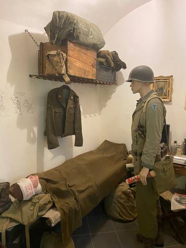 A medic treating a wounded soldier.