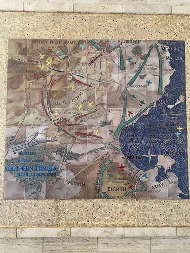 On the walls in the reception area, were large, beautiful maps in mosaic and ceramic tiles, graphically depicting the operations and supply activities of the British and American troops from the November 1942 landings to the Axis surrender in May 1943. 
