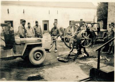 June 3, 1942 Northern Ireland: “Yankee ingenuity at its best.”  The 133rd Infantry Regiment using a jeep’s 4 four-wheel drive transmission to pump water from a well in just minutes that previously took the British many hours to pump manually.