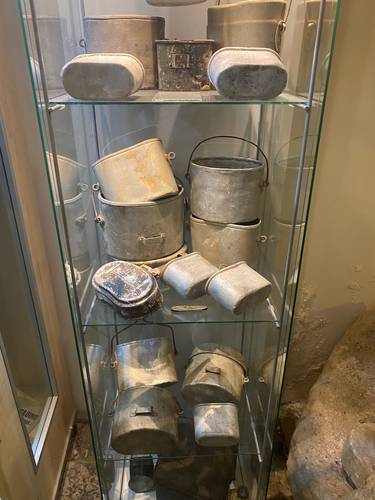 The many WWII artifacts in the museum were found scattered in the area, primarily by Luciano and his band of dedicated volunteers. Shown here are a variety of ration tins.