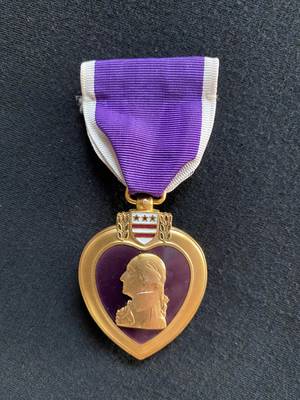 Major Arthur L. Ludwick Jr., M.D., earned the Purple Heart in the Eddekhila, Tunisia area, May 5-9, 1943, while treating and evacuating a seriously wounded soldier.