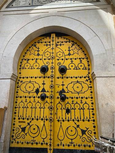One of the many beautiful and  interesting doors while walking the streets in Tunis. Who knows what lies beyond these fortresses of privacy? Most likely, there are lush courtyards and extended family compounds.